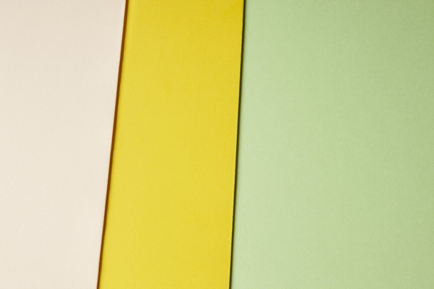 Colored cardboards background green yellow beige tone. Copy spac - Фото, зображення