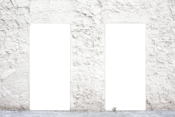Two vertical empty posters on an old white wall. Street advertising billboards with space for you advertisement text or promotion - Photo, Image