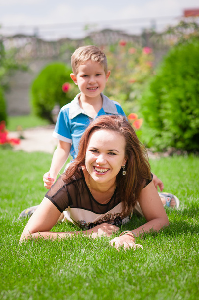 Mother and son having fun on the grass - Photo, Image