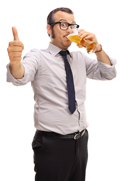Young businessman drinking beer - Φωτογραφία, εικόνα