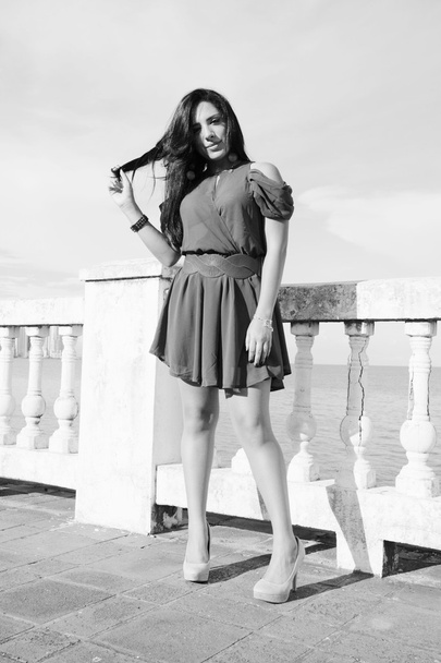 Young woman standing. Black and white concept. - Fotó, kép