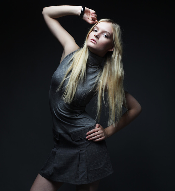 Portrait of beautiful young blonde girl in black dress. - Foto, Bild