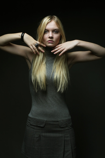 Portrait of beautiful young blonde girl in black dress. - Zdjęcie, obraz