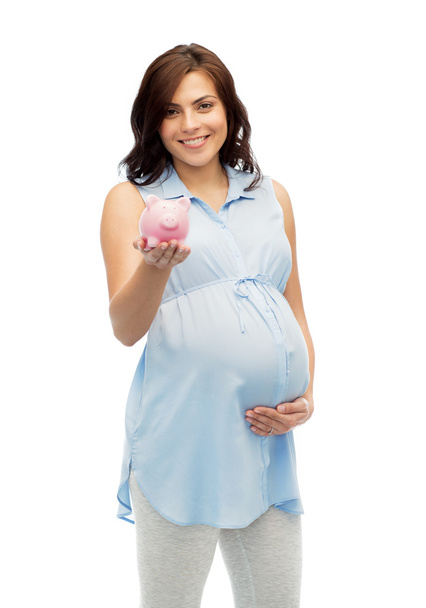 happy pregnant woman with piggybank - Zdjęcie, obraz