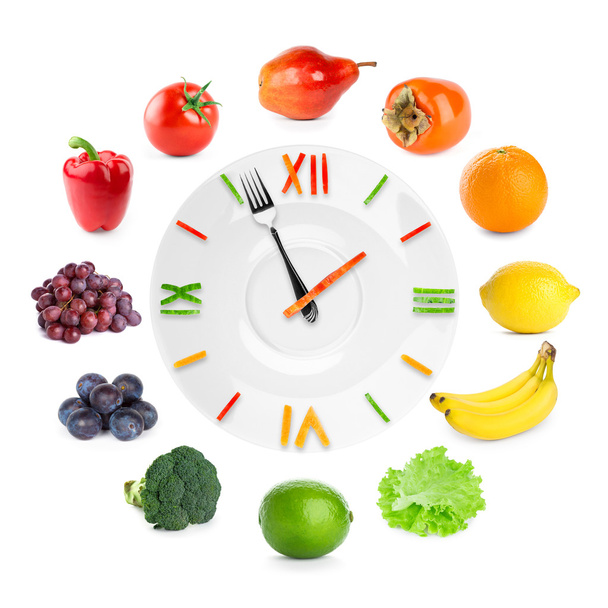 Futteruhr mit Obst und Gemüse - Foto, Bild
