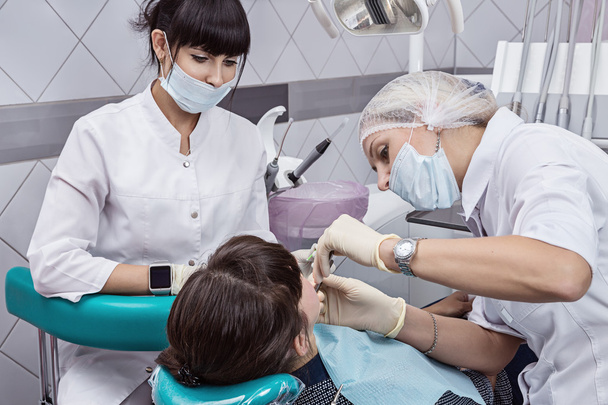 The woman on reception at the dentist. - 写真・画像