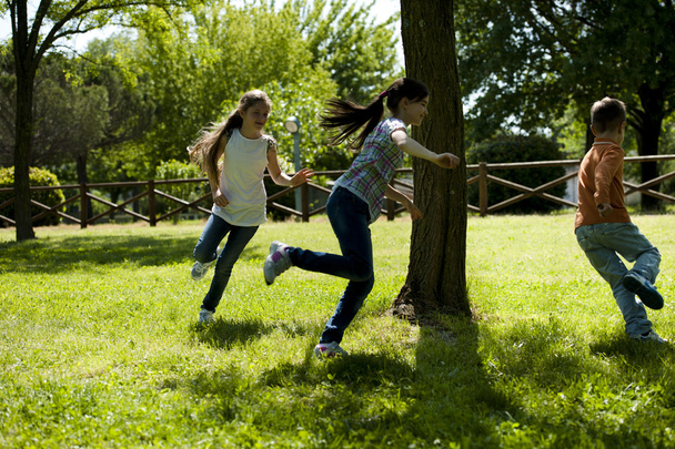Children playing tag - Фото, изображение