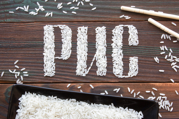 la palabra arroz letras escritas de arroz en una tabla de madera
 - Foto, Imagen