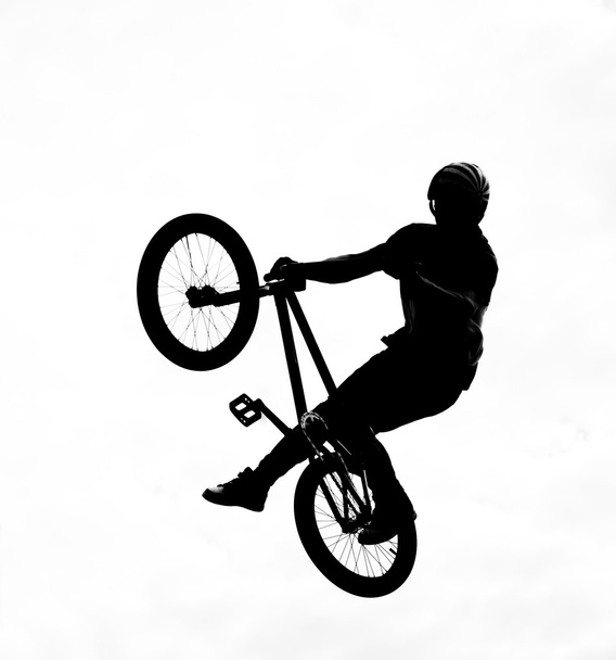 silhouette of bmx riders in action - Foto, Imagen
