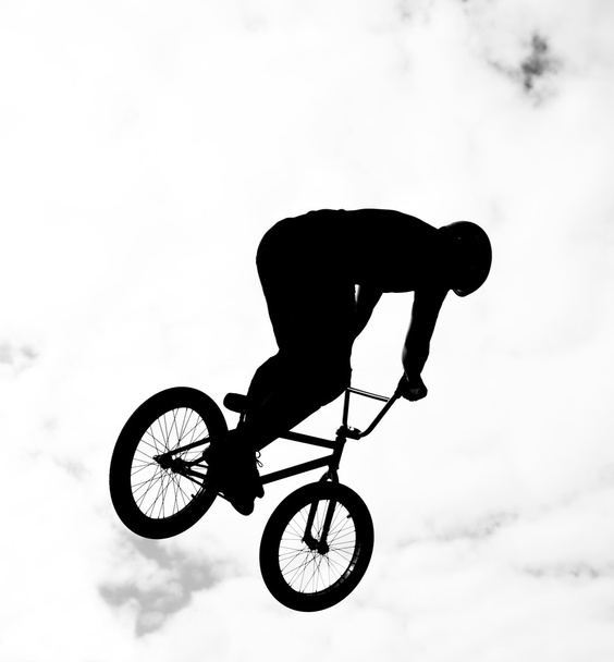 silhouette of bmx riders in action - Фото, зображення