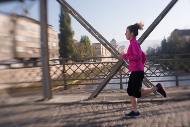 sporty woman jogging on morning - Фото, зображення