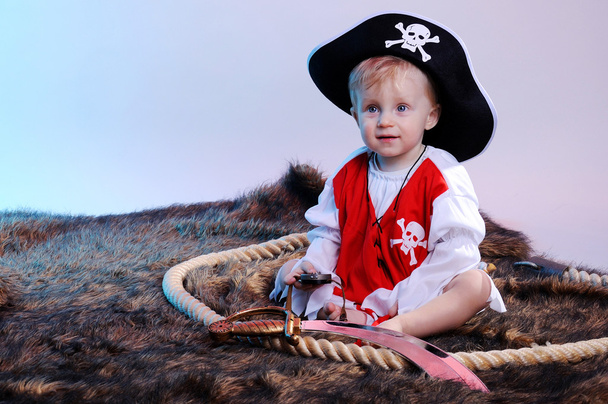 Cute little boy in the pirate costume - 写真・画像