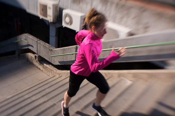 woman jogging on  steps - Zdjęcie, obraz