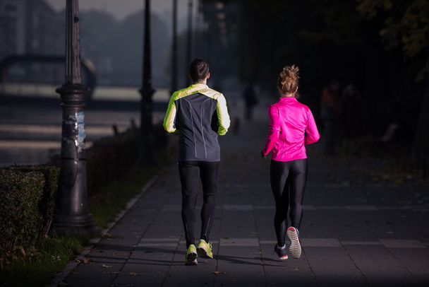 young  couple jogging - 写真・画像