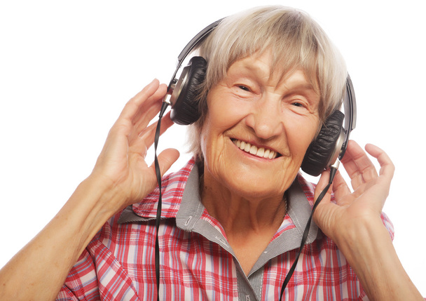 Funny old lady listening music - Фото, изображение
