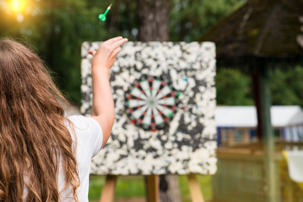 girl playing darts , focus on near-term - Photo, Image