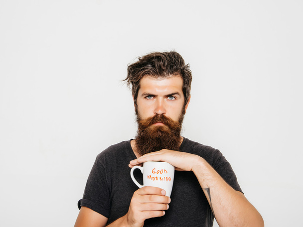 bearded serious man with cup of coffee or tea - Zdjęcie, obraz