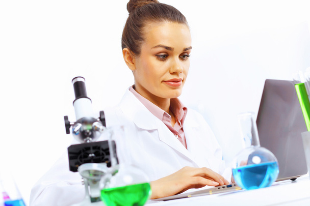 Young female scientist working in laboratory - Фото, зображення