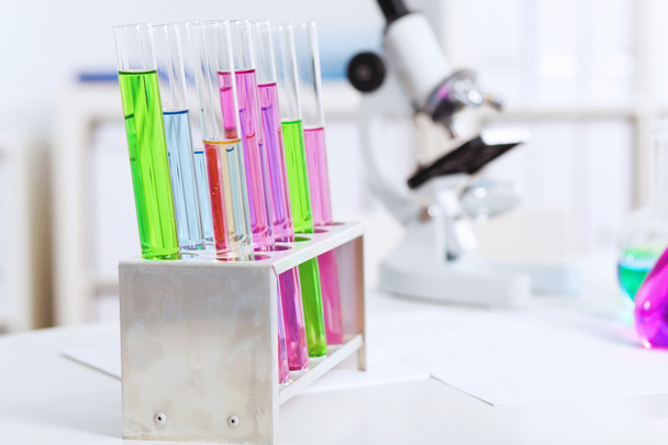 Chemistry laboratory glassware with colour liquids - Photo, Image