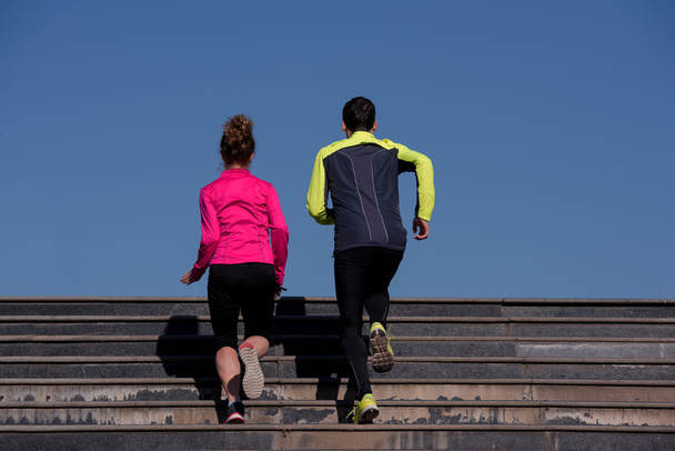young  couple jogging on steps - Photo, Image