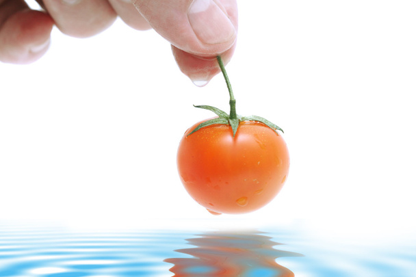 Tomato in hand - Valokuva, kuva