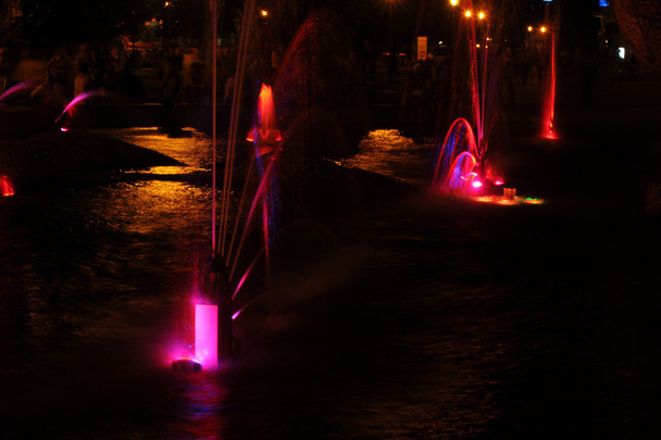 Gaussian blur. It is convenient for the designer. Fountain jet of fluid ejected upward from the pipe holes or the pressure force. Lumiere fountain. rhythmic light effects - Photo, Image