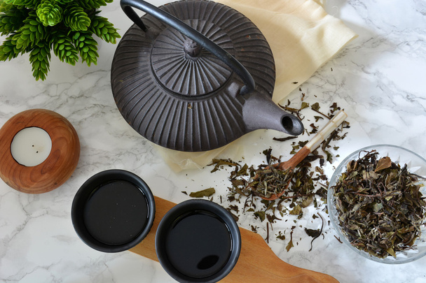 cups of black tea with teapot - Foto, Imagem