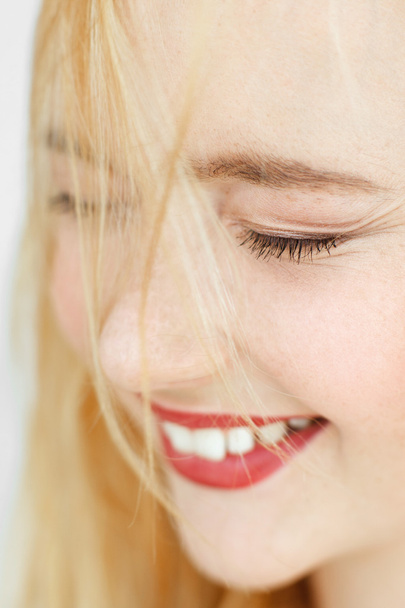 Close-up of cheerful laughing blonde, closed eyes - Φωτογραφία, εικόνα