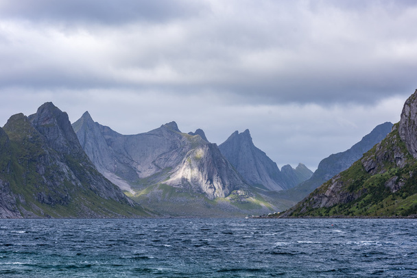 Dramatic summer landscape with sharp mountain peaks in Norway. - Foto, immagini