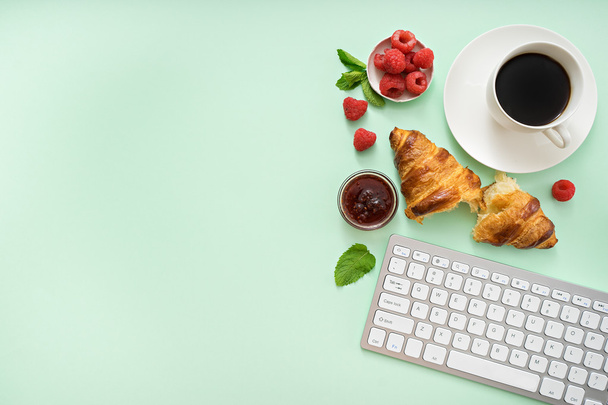 croissant and coffee at workplace - Photo, Image