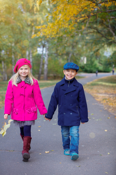 Happy Kids in Autumn Park - Фото, изображение