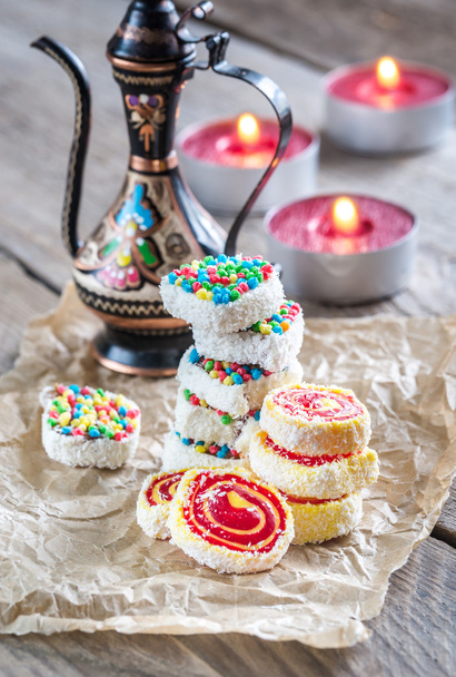 Heap of Turkish delight with burning candles - Photo, Image