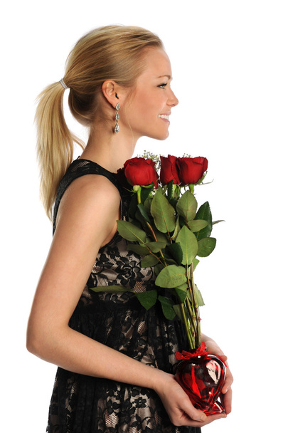 Young Woman Holding Vase with Roses - Valokuva, kuva