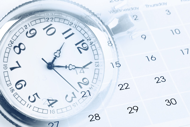 Uhr im Kalender  - Foto, Bild