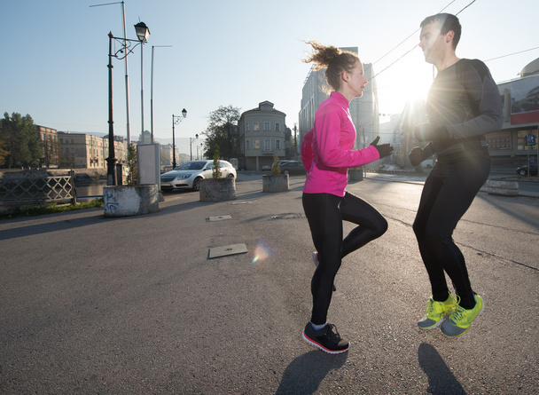 couple warming up before jogging - Foto, immagini