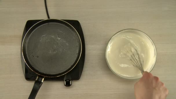 First-person view on chef cooks dough for pancakes - Záběry, video