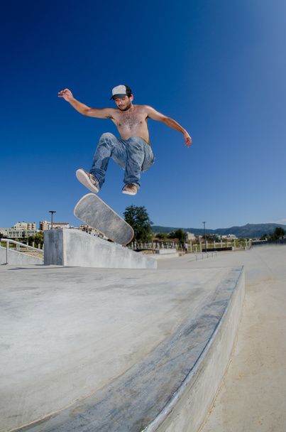 Skateboarder on a flip trick - Фото, изображение