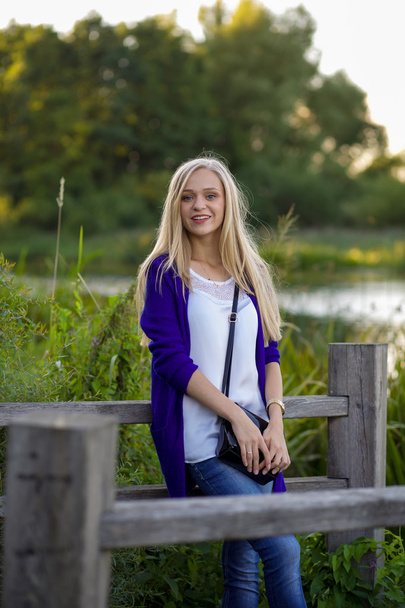 Portrait of pretty blonde girl walking in the park - Zdjęcie, obraz