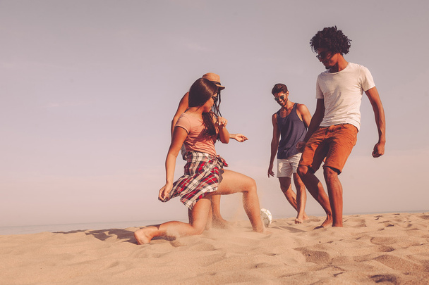 best friends playing beach football - Foto, Imagen