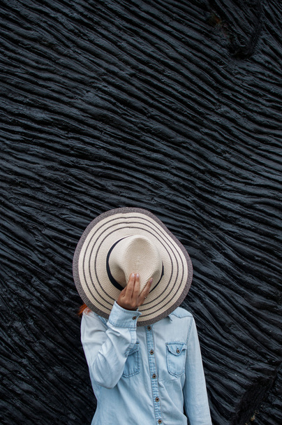 girl covering her face with a straw hat and relaxing - Фото, зображення