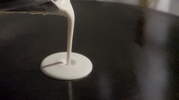 Slow-motion. Dough pour on crepes / pancake maker. SLOG3, close-up. - Footage, Video