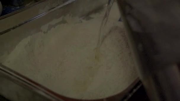 Slow-motion. Preparing dough with water and meal. SLOG3, medium shot. - Footage, Video
