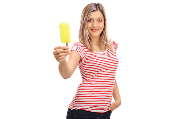 Blond woman offering an ice cream - Foto, Imagen