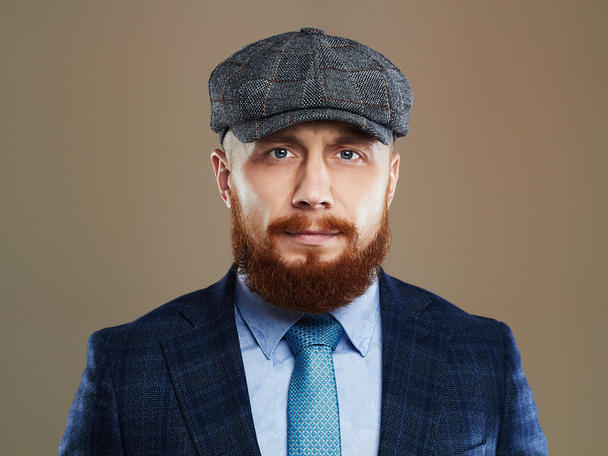 bearded man.Hipster boy.handsome man in hat.Brutal man with red beard - Foto, imagen