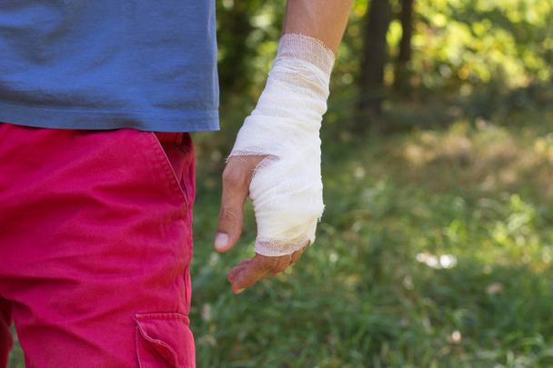 Bandage on a hand wrist, an independent emergency in nature. Whi - Photo, Image