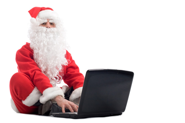 santa claus sitting and using laptop - Photo, Image