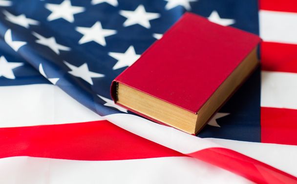 close up of american flag and book - 写真・画像