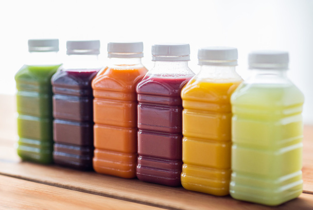 bottles with different fruit or vegetable juices - Fotografie, Obrázek