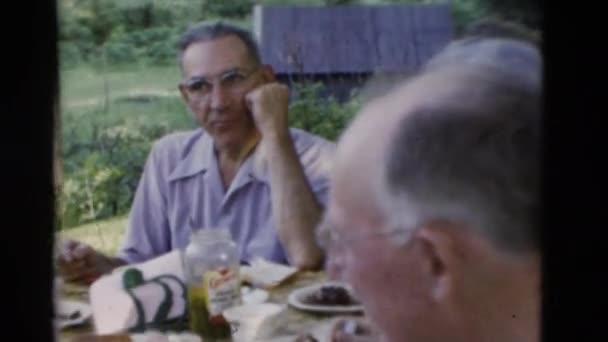 a family gathering in the mountains - Materiał filmowy, wideo