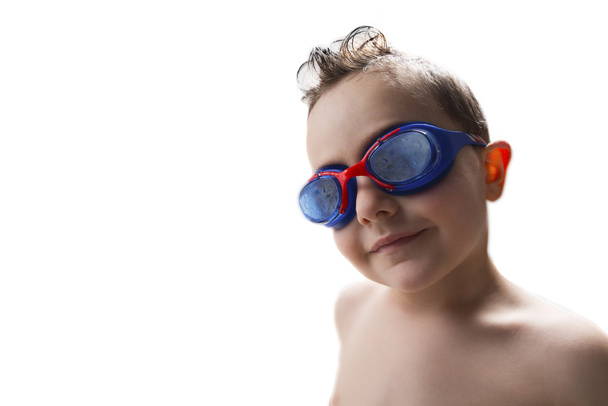 child in the pool with goggles - Photo, image